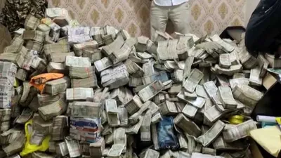ed seizes huge pile of cash in raid from jharkhand minister s aide