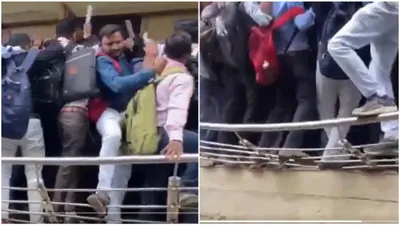 hundreds run over each other for private job in gujarat  railing breaks  video