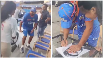 watch  female mi fan touches rohit sharma s feet at wankhede