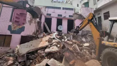 watch  bulldozer demolishes illegally constructed house of udaipur stabbing accused