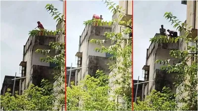 tense moment at andhra pradesh deputy cm s office as woman climbs building in suicide bid