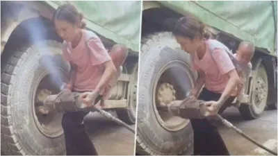 watch  mother fixes truck tyre with child on her back  goes viral