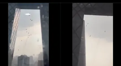 dramatic video captures window cleaners  harrowing ordeal on beijing skyscraper during storm