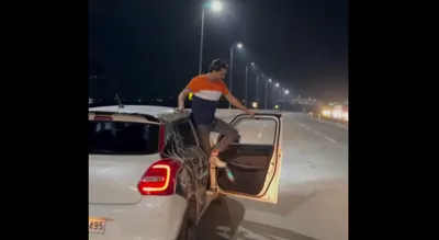 man s dangerous car stunts on mumbai roads captured in viral video  police take action