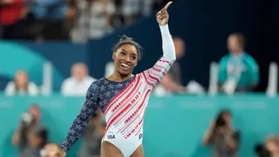 simone biles takes home gold again  but why her diamond goat necklace is making waves