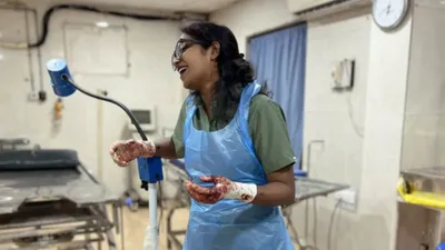gynecologist s viral post delivery photo stirs debate with  blood soaked  hands