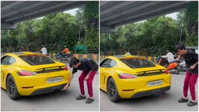 viral  hyderabad man slammed for risky stunt of lighting cigarette from porsche exhaust