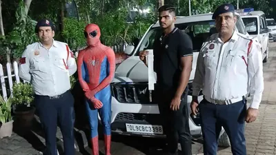 delhi police fine man dressed as spiderman for clinging to suv bonnet