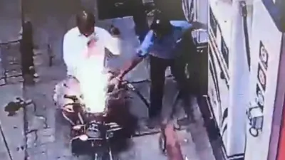 viral video  phone call sparks fire  engulfs bike in flames at maharashtra petrol pump