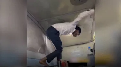 watch  passenger s spider man move to reach train toilet goes viral