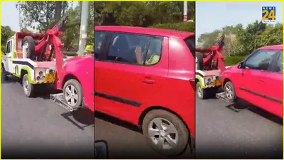 noida  towing van drags car with 2 senior citizens sitting inside  video surfaces