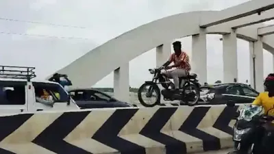 watch  man drives bike on divider in tamil nadu s trichy  video viral