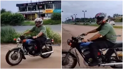 watch  ms dhoni spotted riding a bike in ranchi days after ipl exit