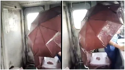 driver shelters under umbrella as indian railways cabin leaks  watch
